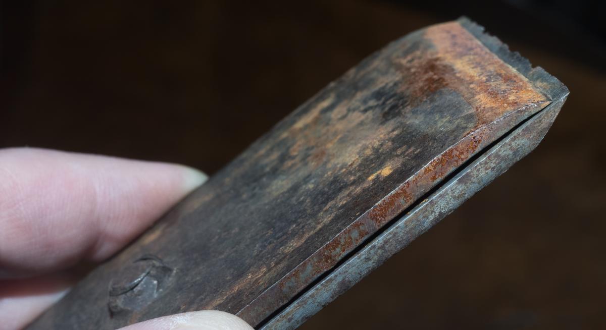 Probably the oldest cap iron in the group. This American cap iron C. 1840 by W. Butcher comes from a Knowles patent plane and predates Stanley by a generation. The thread for the cap iron screw was formed by punching a rough hole in the material and threading the inside.