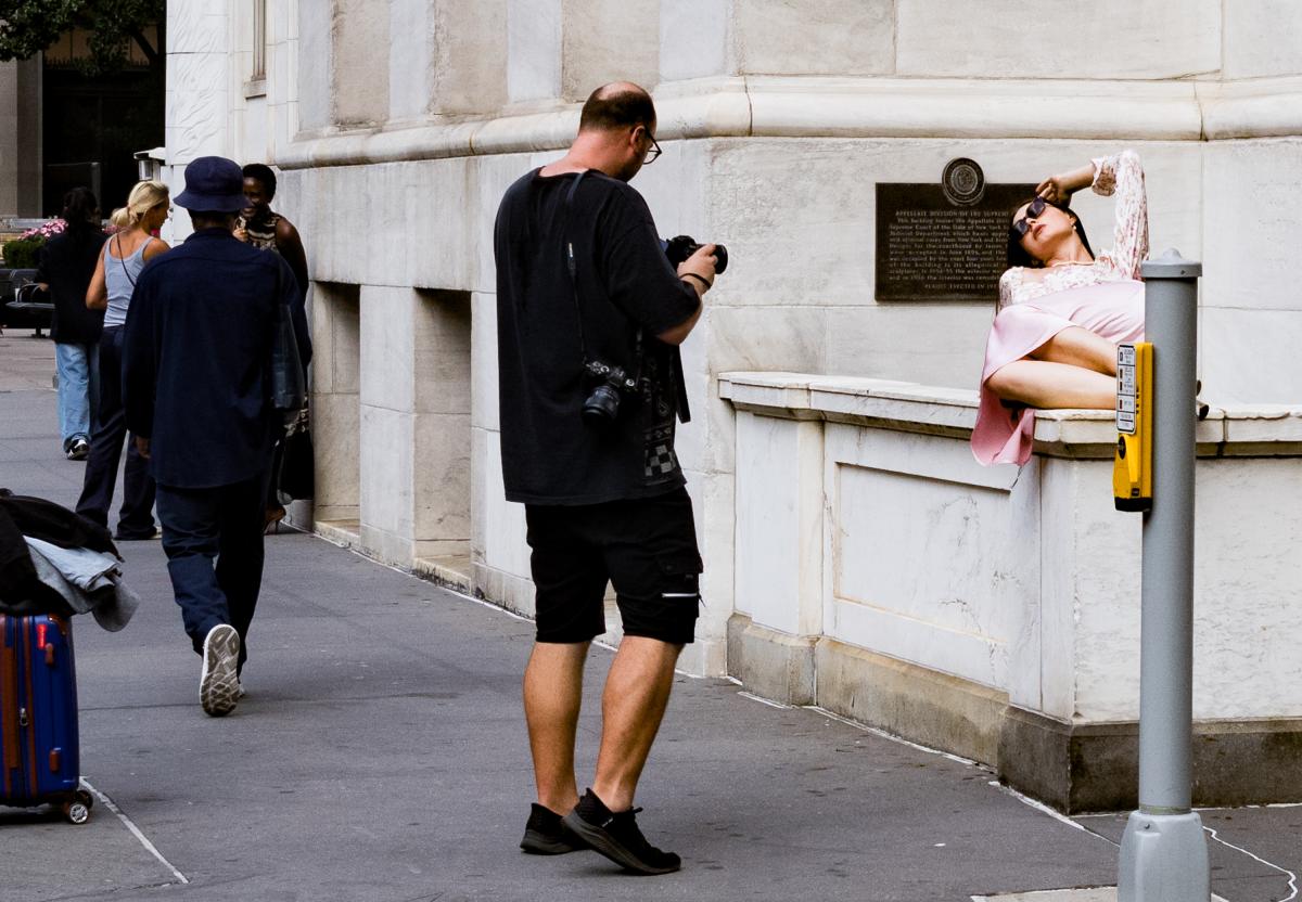 Note: If you happen to be walking on the street and you see very well dressed tall very attractive women being photographed chances are you have stumbled across a model shoot. This one was pretty tame with only one assistant.