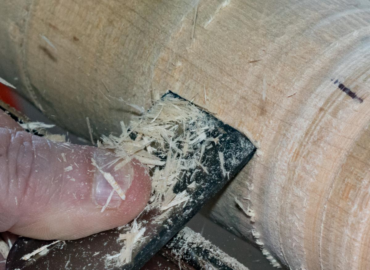 With a straight chisel