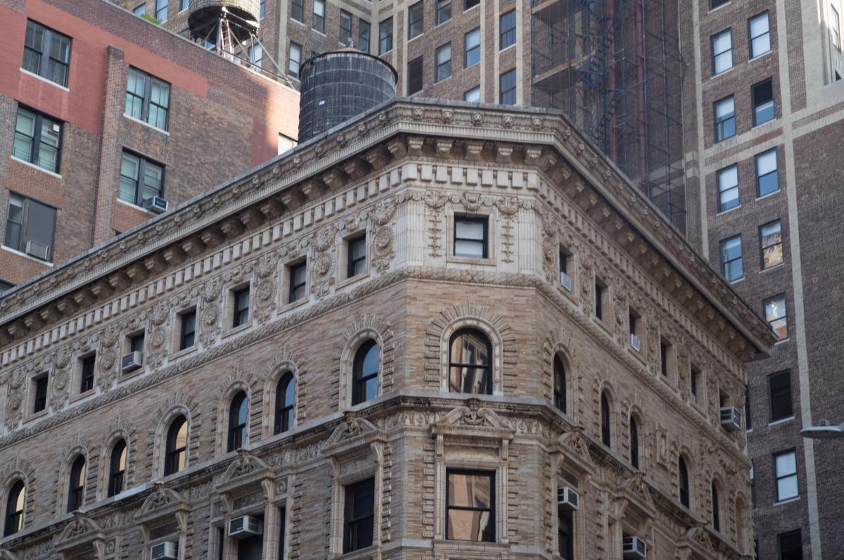  A tour-de-force of cornice carving! It's on the NW corner of 20th Street and Broadway.