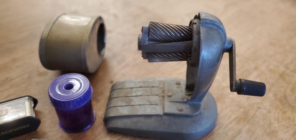 The internal mechanism of the cranked sharpener is an amazing pair of tapered spiral cutters. Awesome!