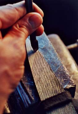 Close-up of stitching a hand-made rasp